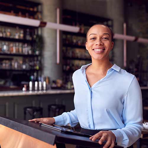 Restaurant owner managing reservations and front-of-house operations